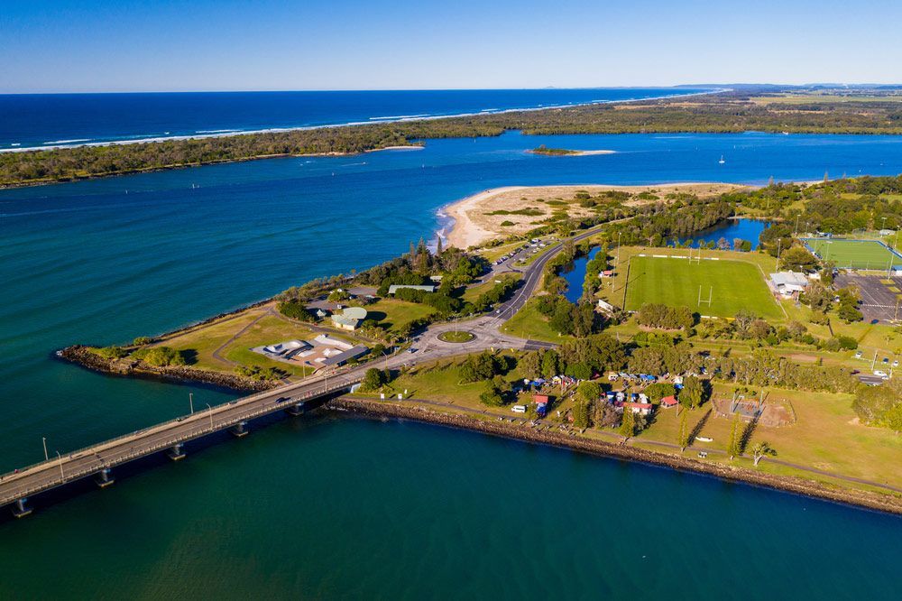 An Aerial View Of A Bridge Over A Ocean — Headlands Glass in Ballina, NSW
